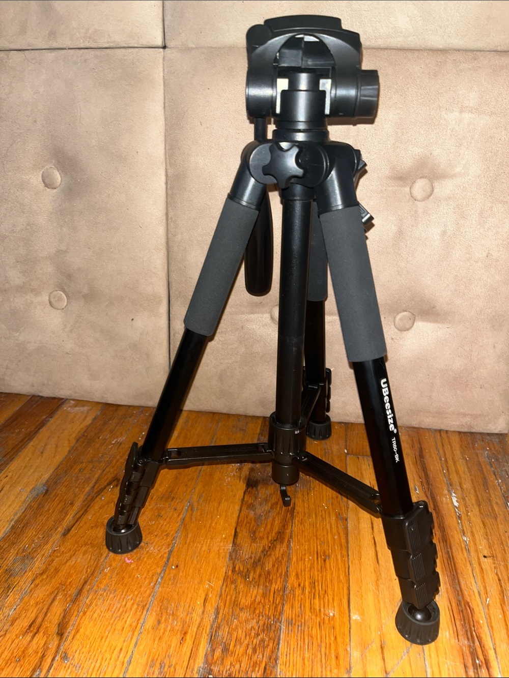 Black Camera Tripod with Foam Grip and Adjustable Head